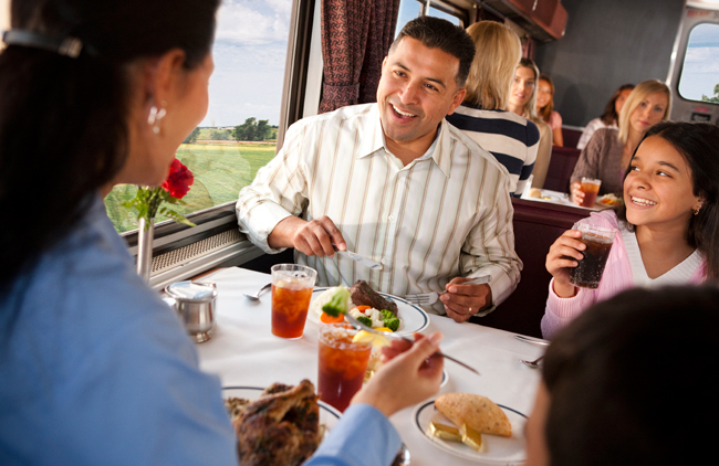 Enjoying the meal experience in the dining car.